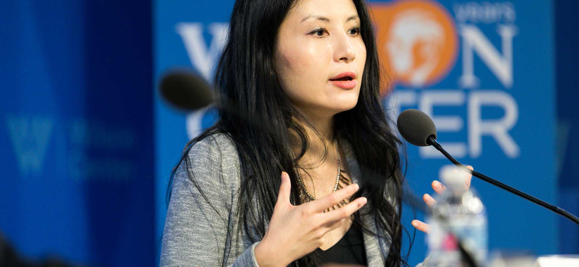 Person giving a speech for The Wilson Center