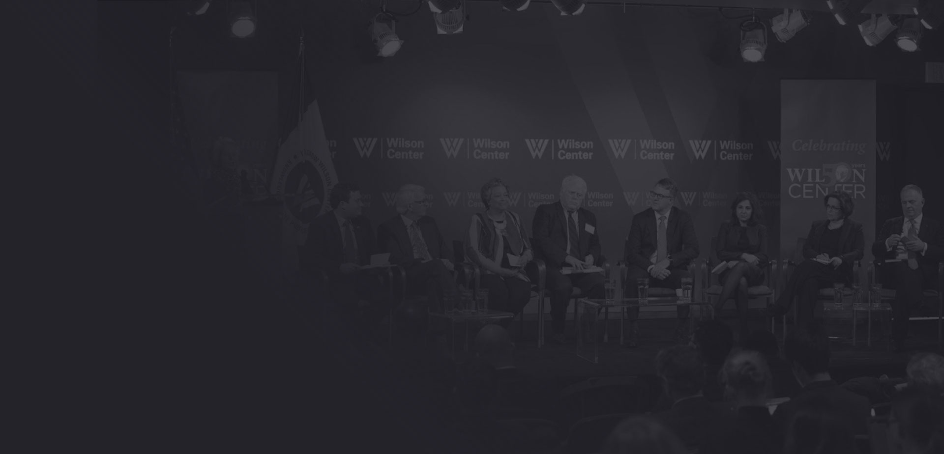 Speakers having a public discourse on stage during an event